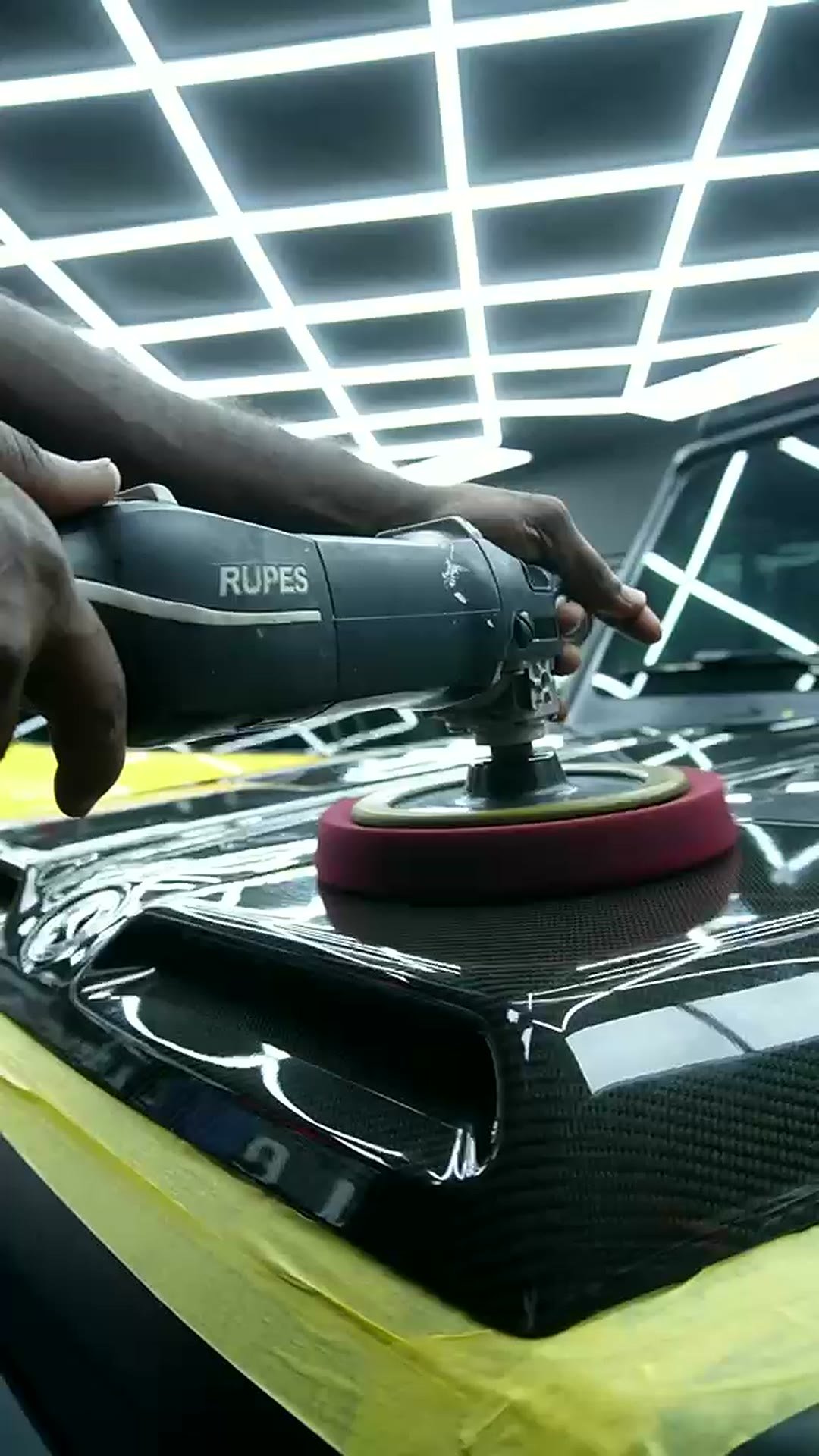 Machine finishing on a carbon fibre bonnet at MAX WAX Dubai